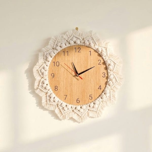 handmade macrame wall clock with wooden face and decorative cotton fringe in boho style